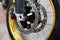 Disc brake with wheel hub on motorbike. Close up of front disc brake on motorcycle. Motorcycle car care and maintenance concepts