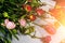 Discarded bouquet decorative roses, dried flowers in rays setting sun