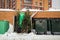 Discarded Christmas trees near trash cans in a residential area