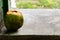 Discarded coconut thrown on marble surface against the blurry background with copy space in right. waste management concept.jpg