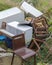 A discarded fridge and chairs