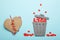 Discarded heart and relationship in couple. Red broken hearts in trash can