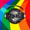 Disco ball and headphones over rainbow background