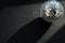 Disco ball lying down on dark background with deep shadows christmas light. Cozy home interior. Home sweet home. After party