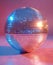 Discoball. Shiny disco ball on pink background