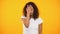 Discontent biracial lady gesturing facepalm on camera against yellow background