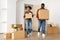 Discontented African American Couple Carrying Moving Boxes Indoor