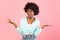 Discontented Black Young Woman Shrugging Shoulders Standing Over Pink Background