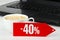 Discount of forty percent, laptop and coffee