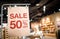 Discount percentage sign display in  fashion department store during sale season period