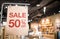 Discount percentage sign display in  fashion department store during sale season period