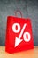 Discount Percentage Symbol on Red Shopping Bag