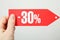 Discount of thirty percent in a woman`s hand