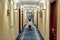 Discover Comfort and Hospitality. Full-length shot of waitress walking along the hall while delivering tray with food in