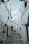 Discover the Hidden Charm of Ostuni\\\'s Historical White Alleyway Through a Medieval Archway