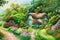 Discover the Magic: A Flower-Lined Pathway to a Delightful Hobbit House in the Countryside with Generative AI