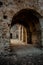 Discover the Secrets of Rocca Imperiale: Italian Street Tunnel Leading to Historic House Entrance