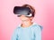 Discover virtual reality. Kid boy wear vr glasses pink background. Child boy play virtual reality game. Explore