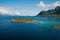 Discover world. Round world cruise. Island stony surrounded idyllic sea water in Norway. Seascape with island on sunny