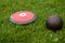 Discus and shot put ball on the grass