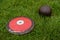 Discus and shot put ball on the grass