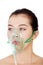 Diseased female patient wearing a oxygen mask