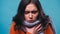 diseased woman in knitted scarf coughing