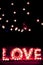 Disfocus of the Love word  light bulbs. Background