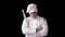 Disgruntled angry chef with rolling pin in white kitchen suit on black wall background. concept idea of cooking