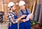 Disgruntled foreman discussing drawing with worker