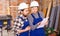 Disgruntled foreman discussing drawing with worker