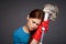 disgruntled woman in rubber gloves mop in hands emotions dark background