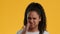 Disgusted Black Teen Girl Pinching Nose Waving Hand, Yellow Background