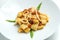 Dish of calamarata pasta with squid and tomato