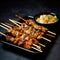 A dish of chicken yakitori kebabs