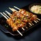 A dish of chicken yakitori kebabs