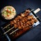 A dish of chicken yakitori kebabs