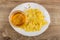 Dish with corn flakes, honey dipper in bowl with honey on table. Top view