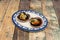 Dish decorated in blue tones with two wonderful Galician-style scallops with their cochas