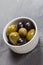 A dish of delicious black and green olives