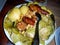 dish with Galician stew ingredients: chorizo sausage, chickpeas, turnip greens