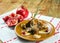Dish of mutton ribs, mushrooms, pomegranate