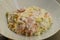 The dish `Paglia e fieno al prosciutto` - typical italian food