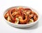 The dish of Pulpo is on a white background.