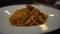 Dish of spaghetti bolognese on table of restaurant. Delicious italian pasta