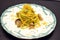 Dish of Spaghetti with seafood and pistachios. Typical Sicilian cuisine.