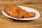 a dish with spanish escalope de pollo a la milanesa, breaded chicken fillets.