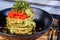 A dish of stacked vegetable patties
