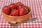 Dish of Strawberries on Red Gingham Tablecloth