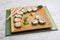 Dish with sushi roles on marble table